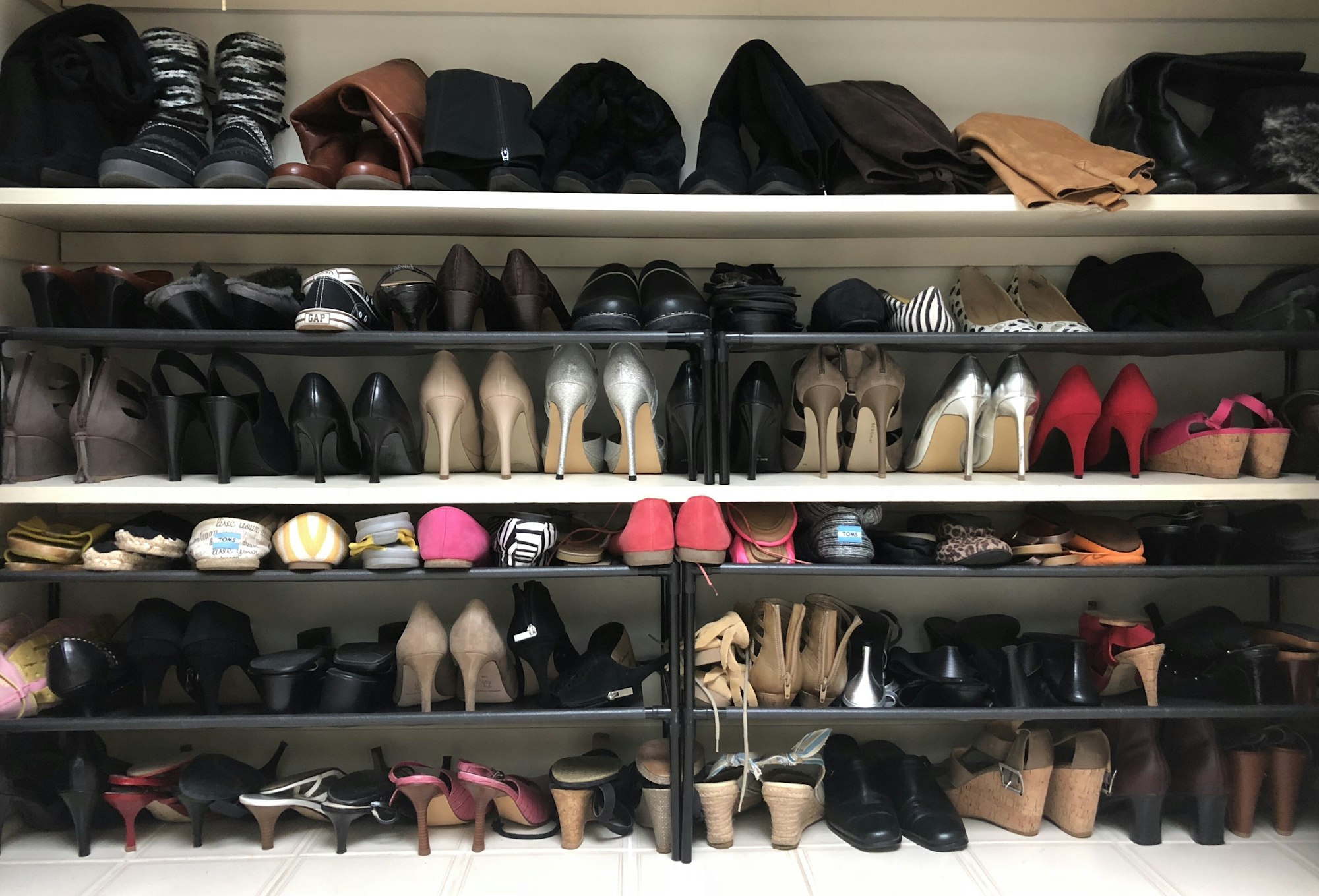 Woman’s shoes organized in the closet during Spring cleaning.